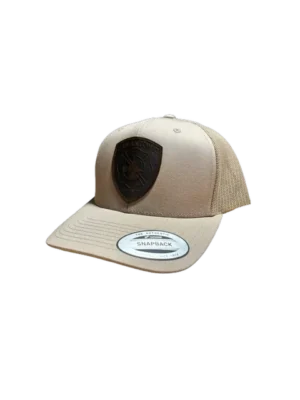 A tan hat with a black shield on it.