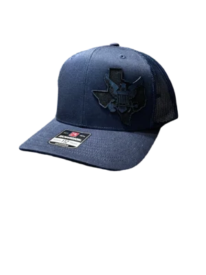 A blue hat with a black texas state logo.