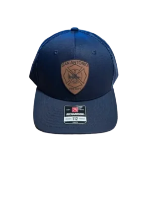 A blue hat with a leather patch on the front.