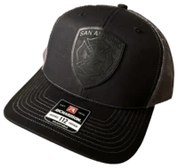 A black hat with an emblem on it.