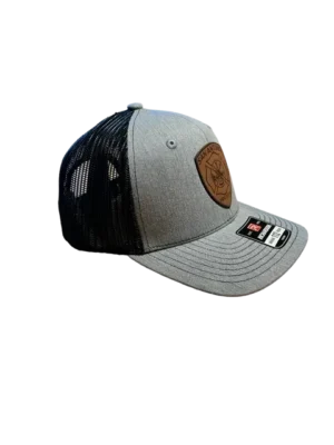 A white hat with a brown patch on it